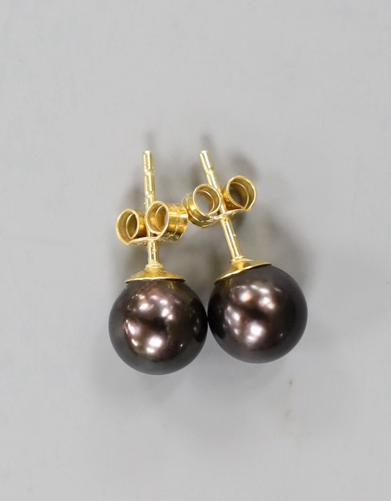 A pair of 18ct and cultured Tahitian pearl set ear studs.